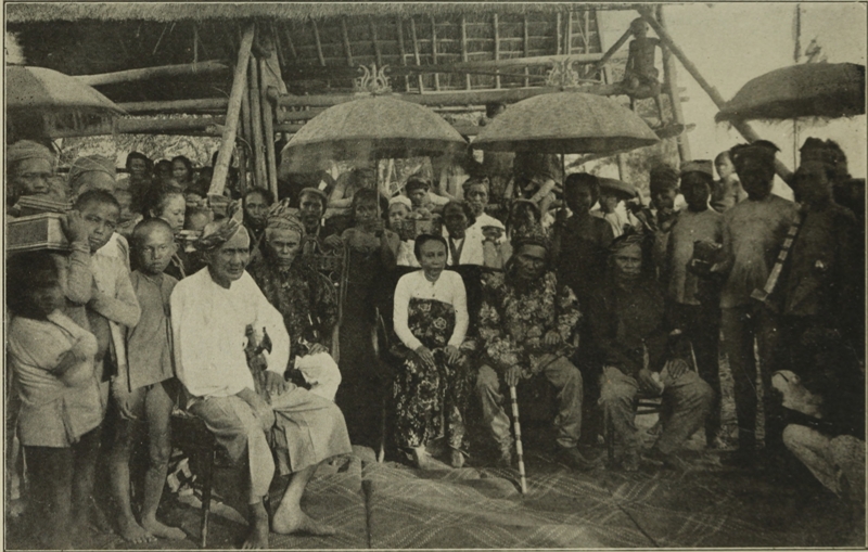 A MORO DATO AND HIS WIFE, WITH A RETINUE OF ATTENDANTS.